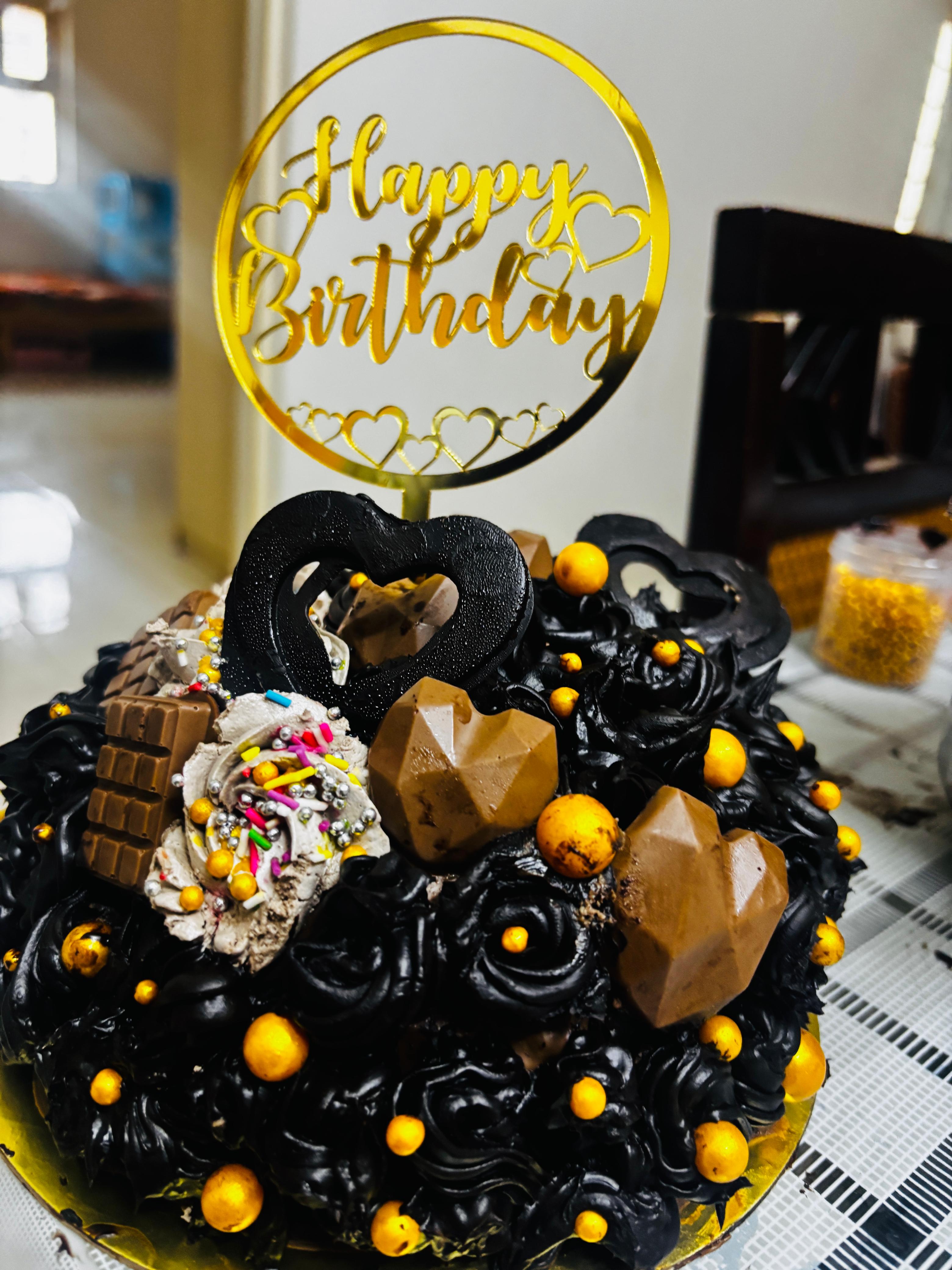 Black and gold chocolate celebration cake