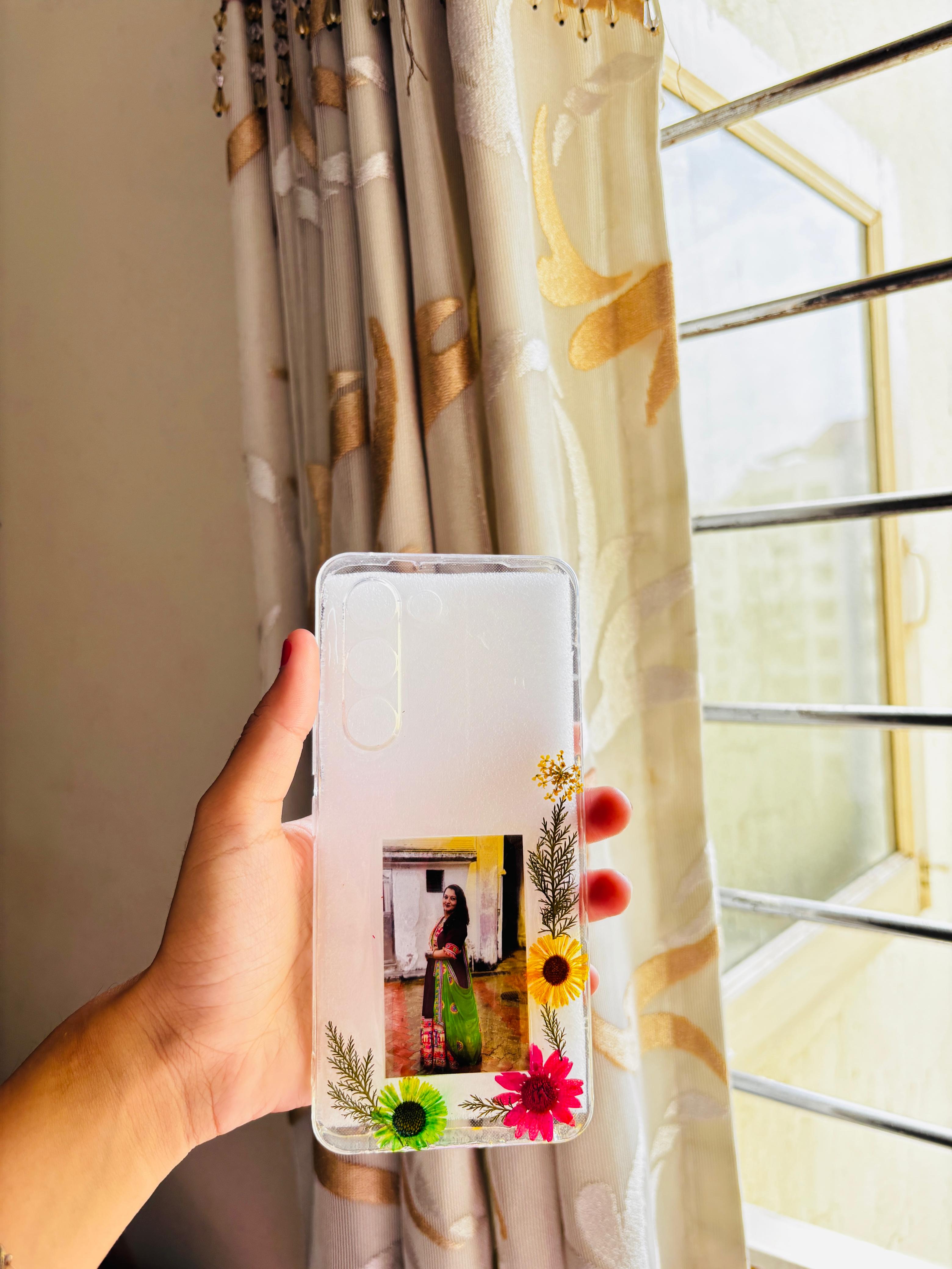 Customized transparent phone case with pressed flowers and photo
