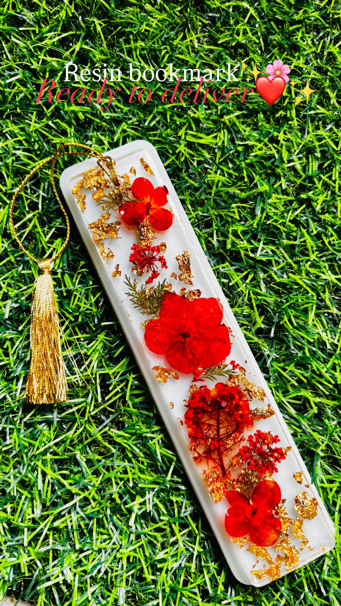 Handcrafted resin bookmark with preserved flowers and gold foil by Melted Magic